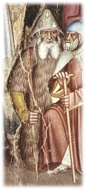 Dos figuras representadas en un fresco. Una de ellas, arrodillada y en posición frontal, va ataviado de peregrino, con lo que aparenta ser una gruesa pelliza de piel y un sombrero cónico